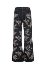 Jeans flare in denim scuro con ricami floreali - retro