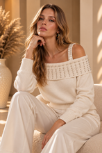 Maglia spalle scoperte con applicazioni luminose