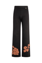 Pantalone wide a palazzo nero con motivo floreale color ruggine